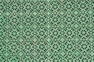 a green metal mesh with a pattern of stars photo