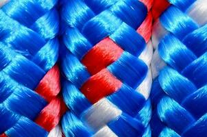 a close up of a braid of red, white and blue yarn photo