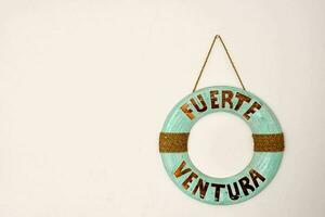 a round sign with the word fuerte ventura written on it photo
