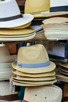 many hats are stacked on top of each other photo