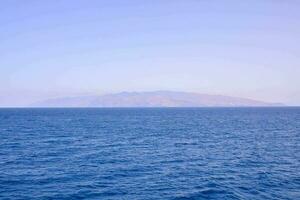 a view of an island in the ocean photo