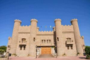 the castle is made of stone and has towers photo