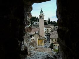 a view of a town through a stone opening photo