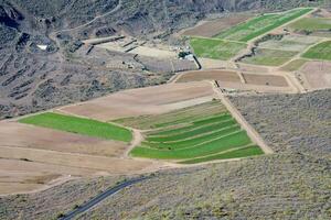 aerial view of a farm in the mountains photo
