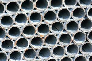 a close up of a pile of metal pipes photo