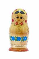 a wooden matryoshka doll with a red and blue dress photo