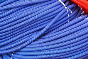 a pile of blue and red hoses photo