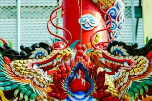 a colorful dragon statue is on display photo