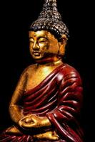 A buddha sculpture isolated on black background photo