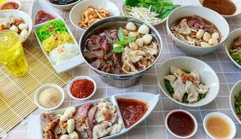 Thai boat noodles with Thai spices and ingredient on background. photo