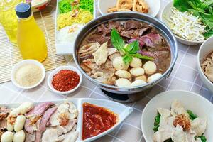 Thai boat noodles with Thai spices and ingredient on background. photo