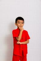 little boy fashion Smiling child in red chinese dress, style and fashion ideas for children. chinese new year photo