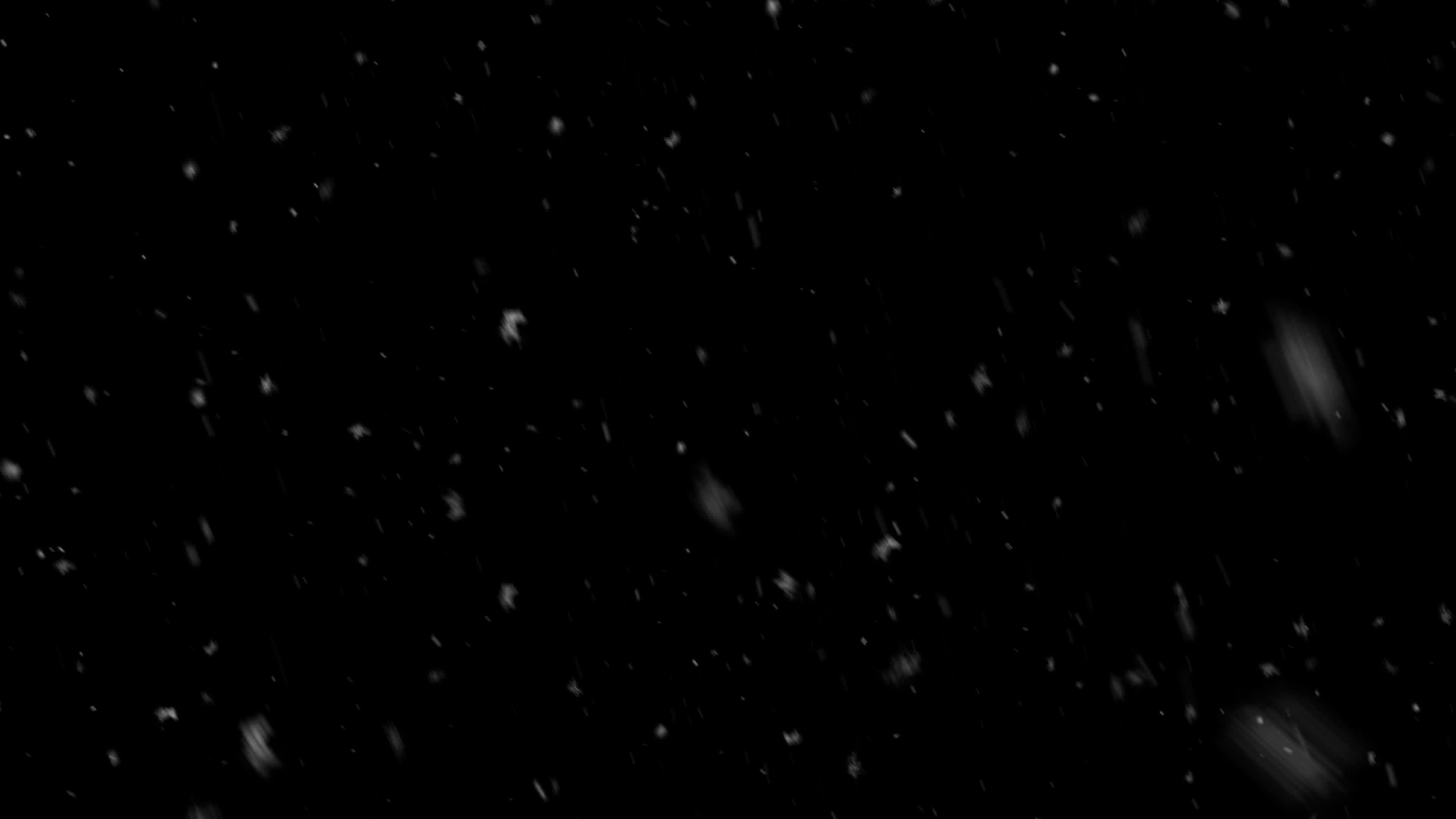 Snow flakes overlay, black background. Winter, slowly falling snow