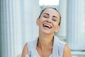 happy business woman laughing near the building, success concept photo