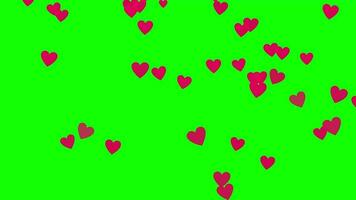 viele Rosa Herzen sind fliegend im das Luft auf ein Grün Hintergrund video
