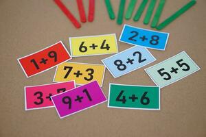 Cards for math subject, numbers plus , addition on colorful cards. Concept, teaching aid, materials for Math subject. Education. Calculation lesson. Cards for game or practice in teaching procedure. photo