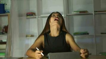 Woman working at home using a computer to communicate video