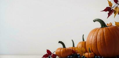 festive thanksgiving pumpkins and autumn leaves arrangement on white background, AI Generated photo