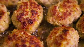 Meat cutlets are fried in oil in frying pan. video