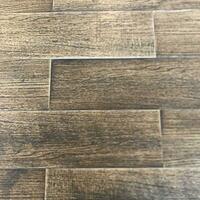 a close up of a wood floor with a dark brown color photo