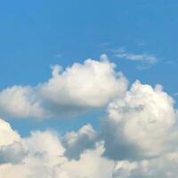 blue sky background with fluffy clouds photo