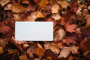 Mock-up of a white tag with autumn maple yellow leaves. AI generated photo