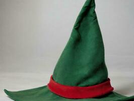 A Green And Red Elf Hat With A Red Stripe. AI Generated photo