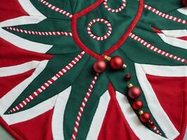 A Christmas Tree Skirt With Candy Canes And Candy Canes. AI Generated photo
