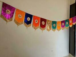 A Colorful Garland With Paper Fans Hanging From The Ceiling. AI Generated photo