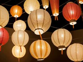 A Bunch Of Paper Lanterns Hanging From A Ceiling. AI Generated photo