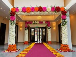 A Wedding Entrance Decorated With Flowers And Orange And Pink Flowers. AI Generated photo