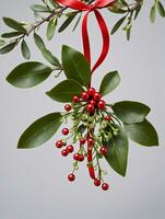 Photo Of Christmas Mistletoe With A Red Ribbon. AI Generated