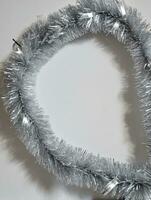 Photo Of Christmas Silver Tinsel Garland. AI Generated