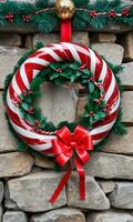 Photo Of Christmas Wreath Intertwined With Candy Cane Stripes And Tinsel Hanging On A Stone Castle Wall. AI Generated