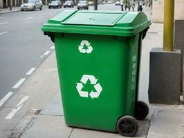 un verde basura compartimiento en el acera. ai generado foto