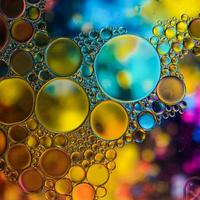 multicolored oil circles on the water, abstract background photo