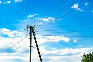 Power electric pole with line wire on colored background close up photo