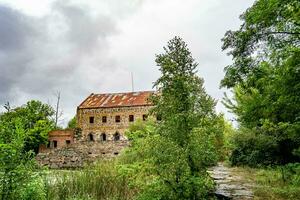 Photography on theme outstanding building beautiful brick old water mill photo