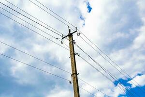 Power electric pole with line wire on colored background close up photo