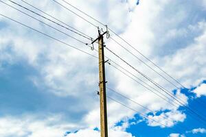 Power electric pole with line wire on colored background close up photo