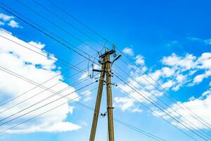 Power electric pole with line wire on colored background close up photo