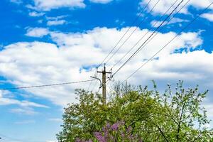 Power electric pole with line wire on colored background close up photo