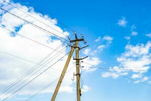 Power electric pole with line wire on colored background close up photo