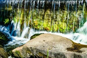 Photography on theme beautiful fall water from garden waterfall photo