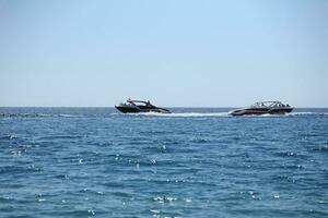 ANTALYA, TURKEY - MAY 15, 2021 Luxurious inflatable rib speed boat cruising in mediterranean deep sea photo