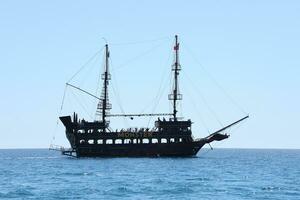 ANTALYA, TURKEY - MAY 15, 2021 Excursion Kemer pirate Boat Tour Monster on the Turkish Mediterranean. photo