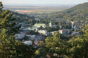 TERNOPIL, UKRAINE - SEPTEMBER 16, 2023 Amazing aerial sunset view on historical center of town with old buildings, churches and monastery photo