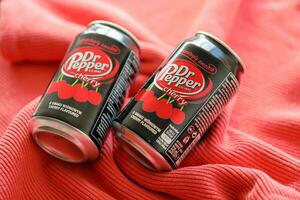 KYIV, UKRAINE - JULY 7, 2023 Dr Pepper cherry drink can on red background photo