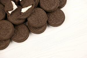 Oreo sandwich cookies on white table. Oreo is a sandwich cookie with a sweet cream is the best selling cookie in the US photo