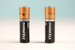Duracell batteries on white background. Duracell is an American brand of batteries and smart power solutions manufactured by Procter and Gamble photo